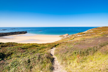 Fototapeta na wymiar Beach Pit on Breton coastline in France Frehel Cape region with its sand, rocks and moorland in summer.