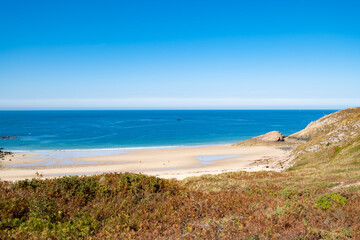 Fototapeta na wymiar Beach Pit on Breton coastline in France Frehel Cape region with its sand, rocks and moorland in summer.