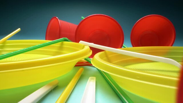 extreme close-up, detailed. set of multicolored plastic dishes on a blue background