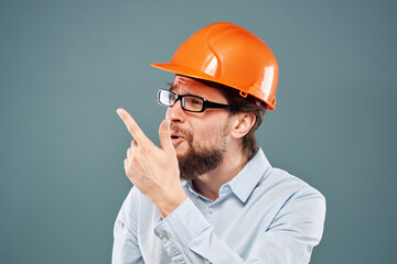 emotional man wearing glasses orange helmet work industry
