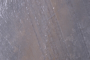 Wet stone texture with stripes for background.