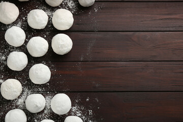 Snowballs on wooden background, flat lay. Space for text