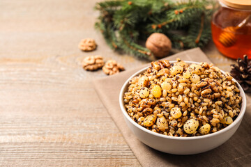 Traditional Christmas slavic dish kutia served on wooden table. Space for text