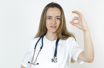 Medicine and health concept. Doctor woman shows gesture - OK.