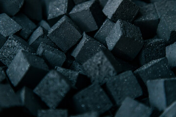 black charcoal for hookah. Coal texture.