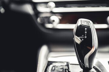 Luxury modern car interior. Automatic gearbox lever; Automatic transmission gearshift stick....