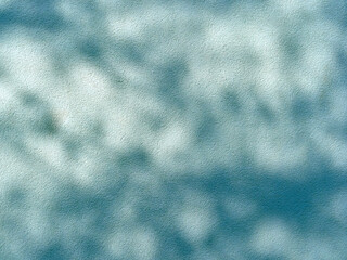 Rough wall with dark shadows.