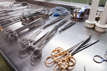 many Cleaned and disinfected instruments lie in a sterilization department of a hospital
