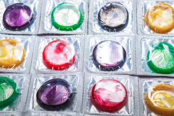 Colorful condoms background.