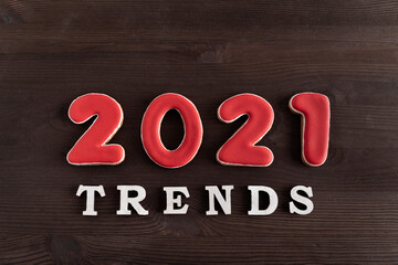 Inscription 2021 trends on wooden background. Popular destinations in 2021.