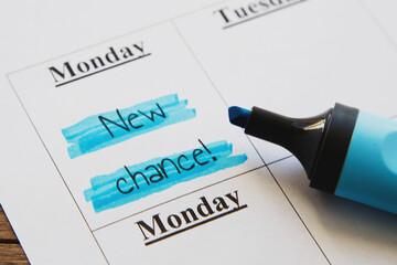 planner calendar monday with highlighted inscription new chance, motivation concept 