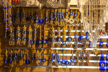 Glass material for decorative and decoration sold in the gift shop, colorful beads, colorful handmade hanging glass ornaments made of evil eye beads and organic thread.