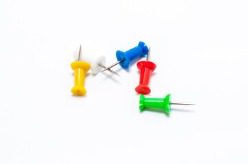 Pins in different colors, collection of various pushpins on white background