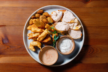 Chicken nuggets with toast and pate.