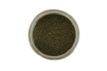 grains of smokeless gunpowder in a jar on a white background