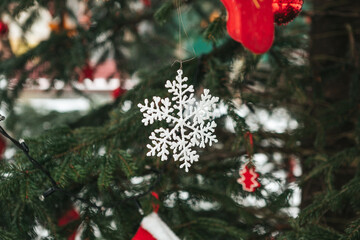 Christmas decoration on a tree - a white snow flake