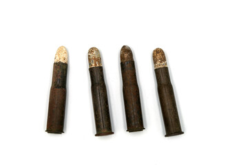 vintage rifle cartridges with lead bullet on white background