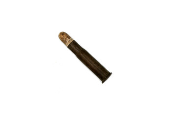 vintage cartridge with black powder and lead bullet on white background