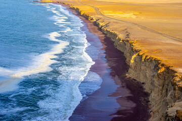 Peru, Paracas, at the Natural Reserve of Paracas. The famous red sand coastline "Playa Rojas" .