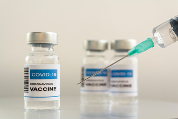 Syringe and laboratory Injection Vials with Covid-19 coronavirus vaccine