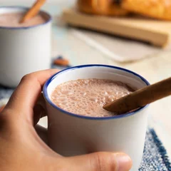 Fotobehang Hot cocoa with cinnamon on white background © Guajillo studio