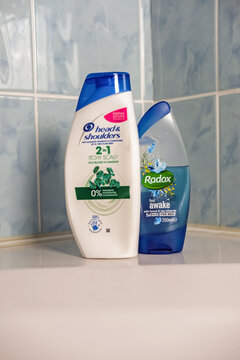 Norwich, Norfolk, UK - November 29 2020. An illustrative editorial photo of selective focus of Radox shower gel beside a bottle of Head and Shoulders 2 in 1 hair shampoo and conditioner