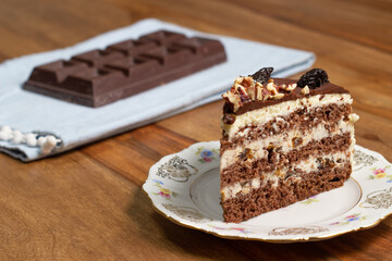 slice of homemade cake with chocolate and nuts