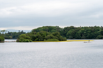 Ross lake, boats and kayaks, Killarney National Park, County Kerry, Ireland near Castle Ross. Wild Atlantic Way, Ring of Kerry