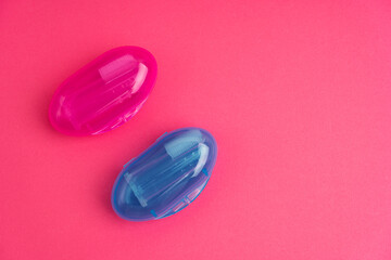 Compact toothbrush fingertip. Travel hygiene close up