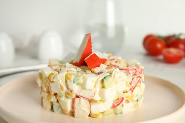 Delicious salad with fresh crab sticks on plate, closeup