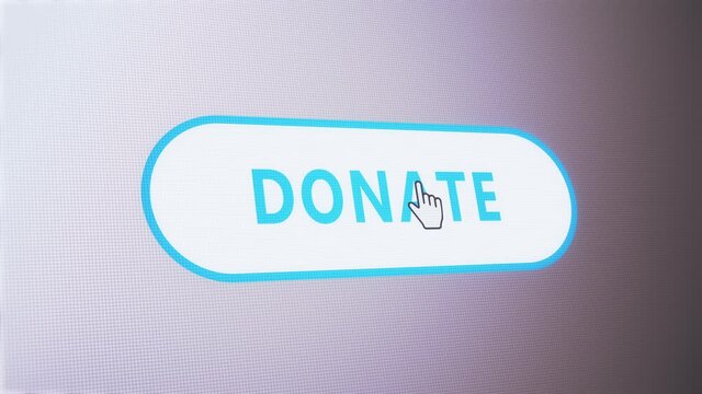 donate button pressed on computer screen by cursor pointer mouse.Concept of help,charity,support,funding,contribute and assist someone or something.