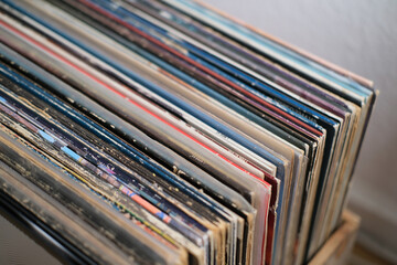 many vinyl records in a box, the mood is to listen to retro music, collects old analog songs