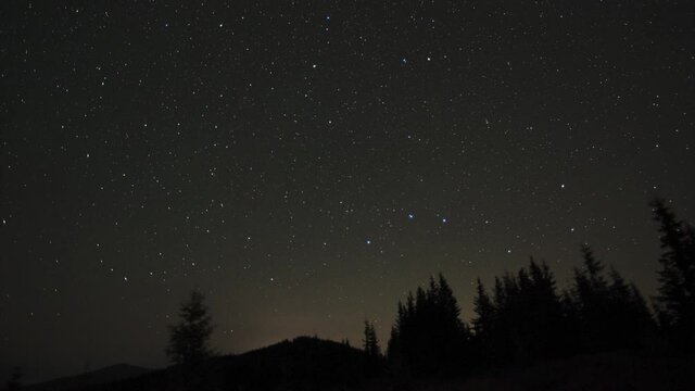 Timelapse starry sky and starfall in the carpathian mountains. High quality 4k footage