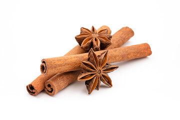 Cinnamon sticks and anise stars on white background