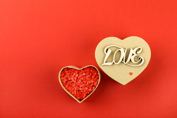 Gift box with sweets in the shape of a heart.Traditional greetings on Valentine's Day