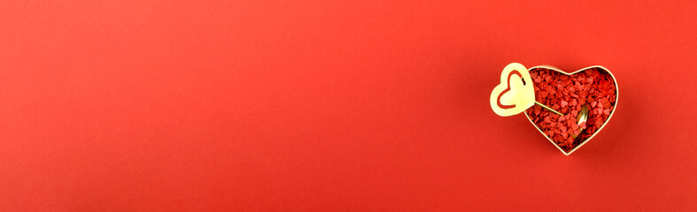 Gift box with sweets in the shape of a heart.Traditional greetings on Valentine's Day