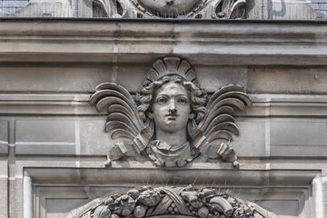 Architectural fragments of XIX arrondissement City hall (inscription: Mairie du XIX Arr, 1878) in Paris. XIX arrondissement called Butte-Chaumont, situated on right bank of River Seine. Paris, France.