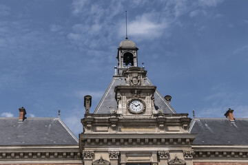Architectural fragments of XIX arrondissement City hall (inscription: Mairie du XIX Arr, 1878) in Paris. XIX arrondissement called Butte-Chaumont, situated on right bank of River Seine. Paris, France.