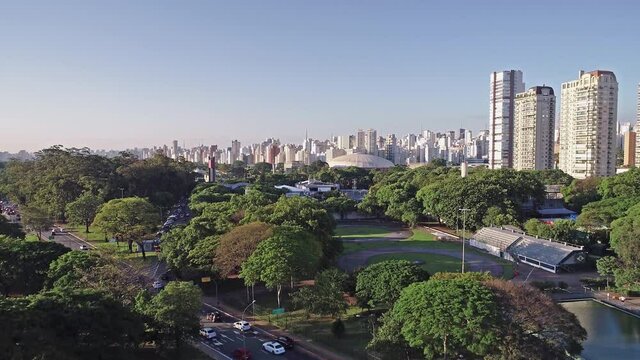 Aerial view of Sao Paulo city and Ibirapuera gymnasium, next to Ibirapuera Park. Prevervetion area with trees and green area of Ibirapuera park  in Sao Paulo city,  Brazil.