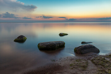 Beautiful scene with calm sea and stones.