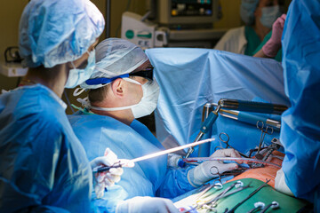 Surgeons in the operating room do operation