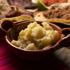 Mexican potato at taqueria on wooden background