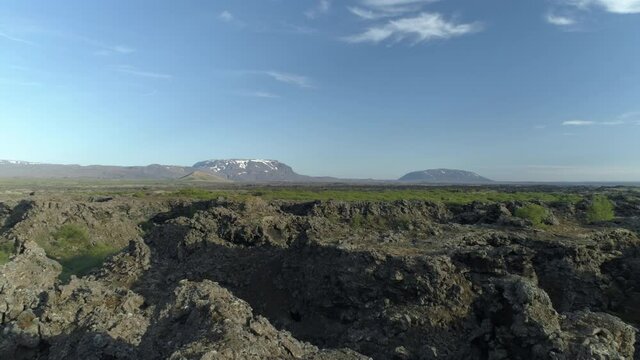 Flying over rugged volcanic terrain Dimmu Borgir Iceland revealing aerial