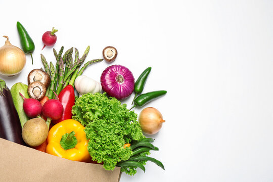 Different fresh vegetables on white background, top view