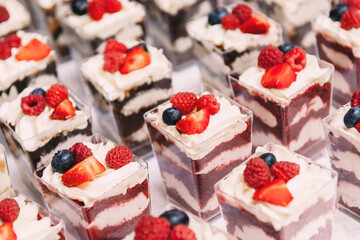 Cupcakes with blueberries, strawberries and raspberries