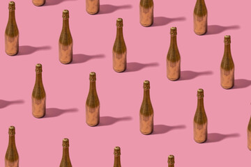 Pattern made of champagne bottle painted in gold color