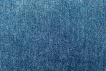  Close up blue jeans denim texture. Denim fabric background.