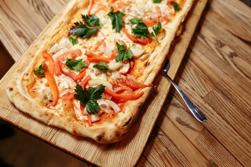 Pizza on wooden table top view. Fast food. Post blog social media. with copy space. Pizza ready to eat