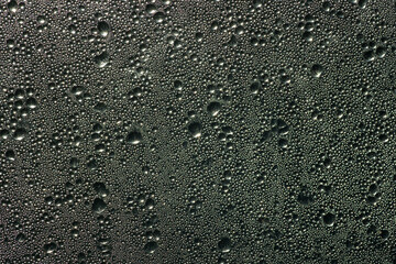 Water drops on the glass in the sunlight