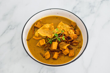 plant-based food,  vegan gyoza and marinated tofu with teriyaki vegetables in curry sauce